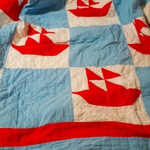 Sailboat themed, light blue, white, and red, twin quilt